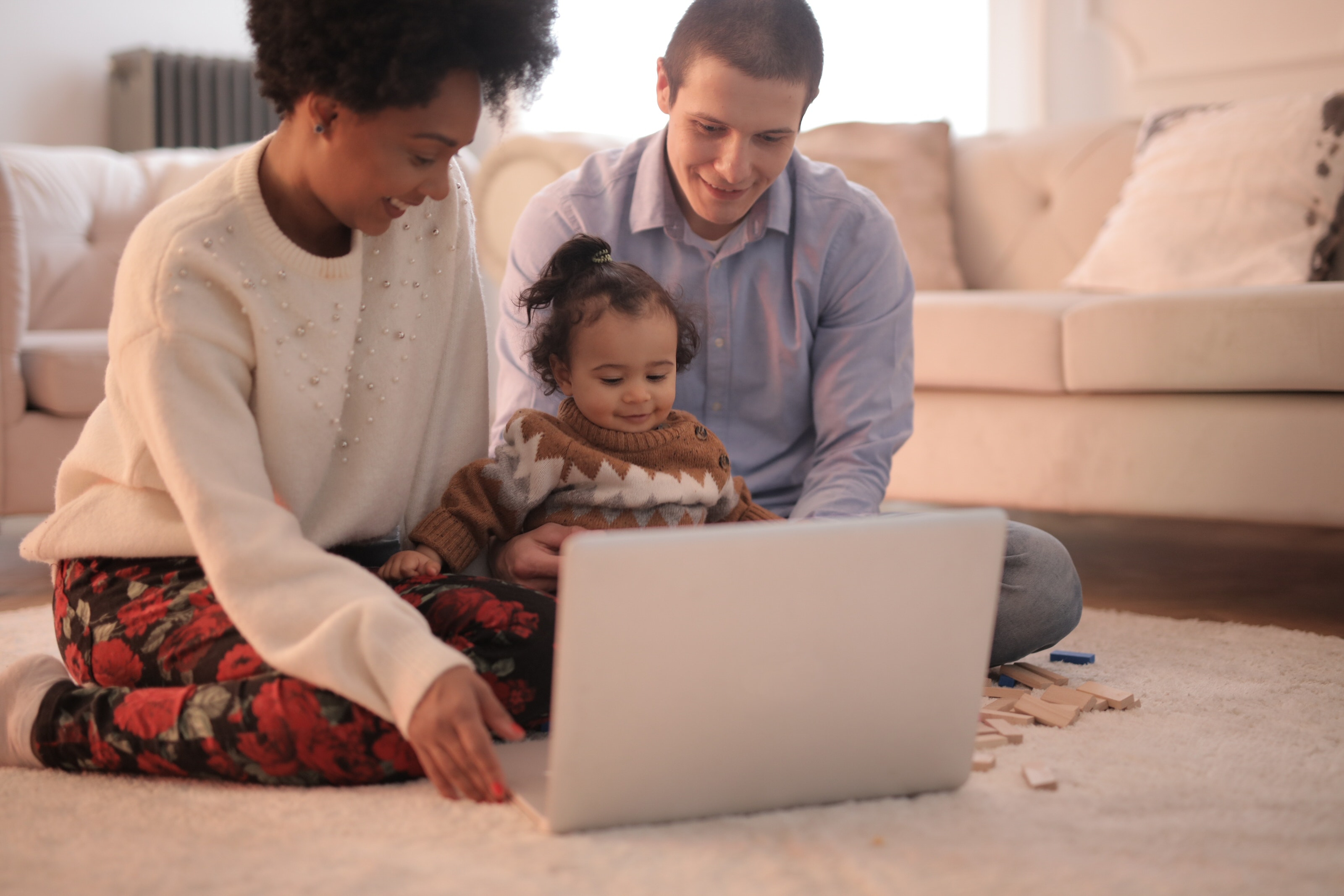 Mixed Family looking at laptop