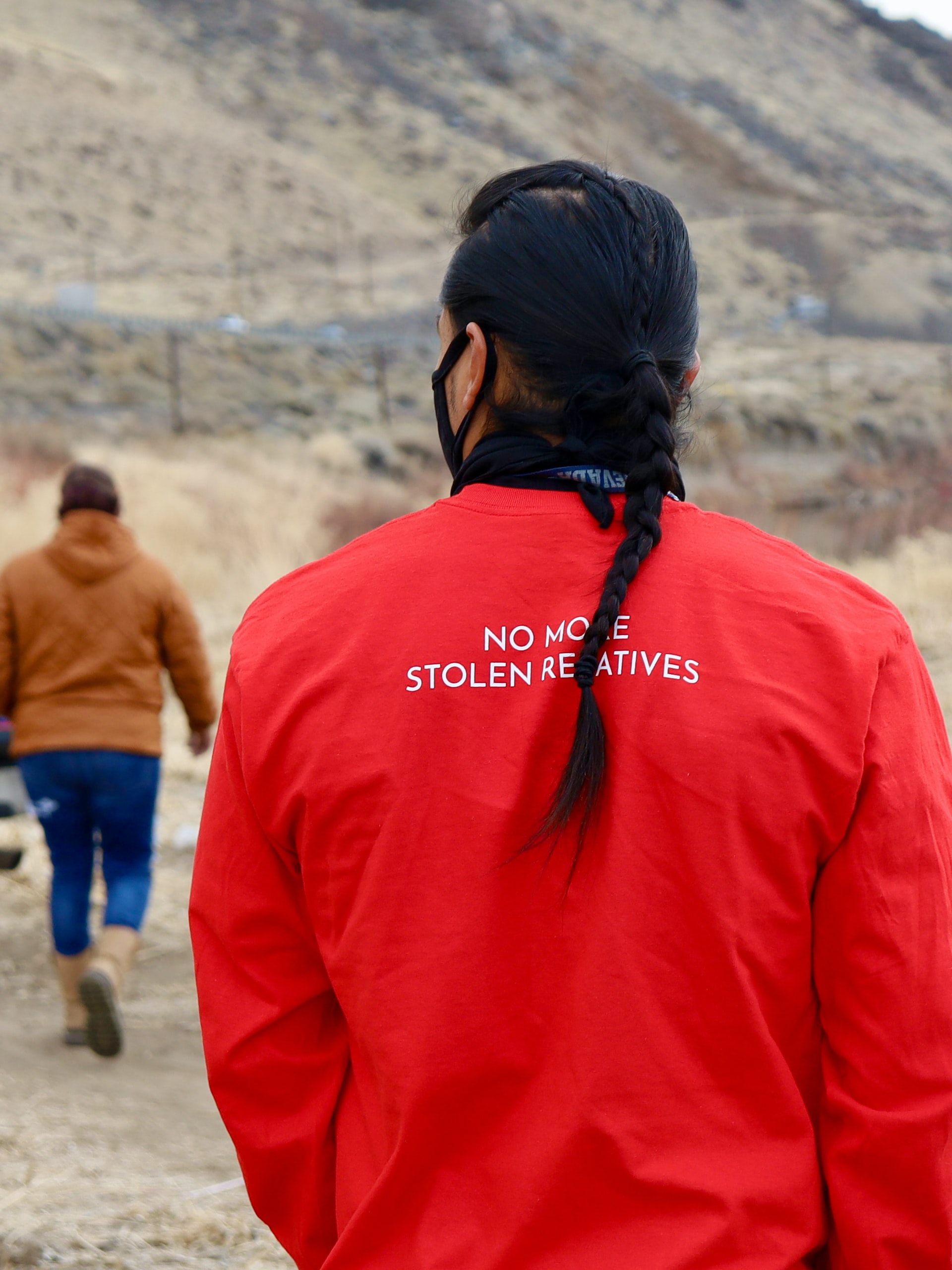 No More Stolen Relatives Red Tshirt wearing person